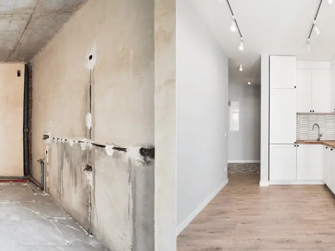 Modern kitchen renovation with white cabinets and marble countertops